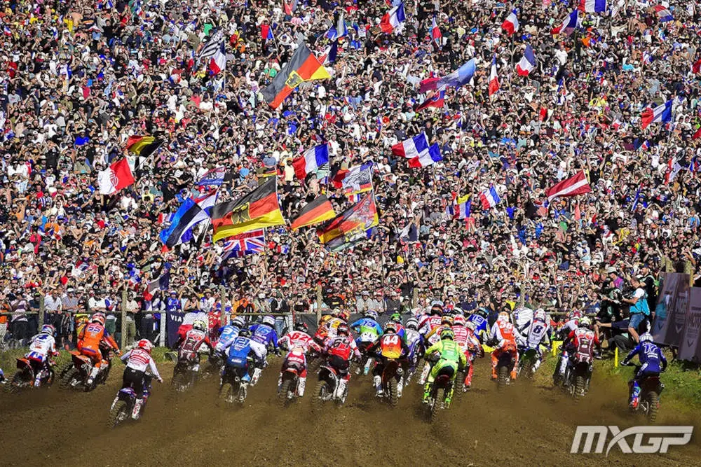 The start of a race in front of a huge crowd.