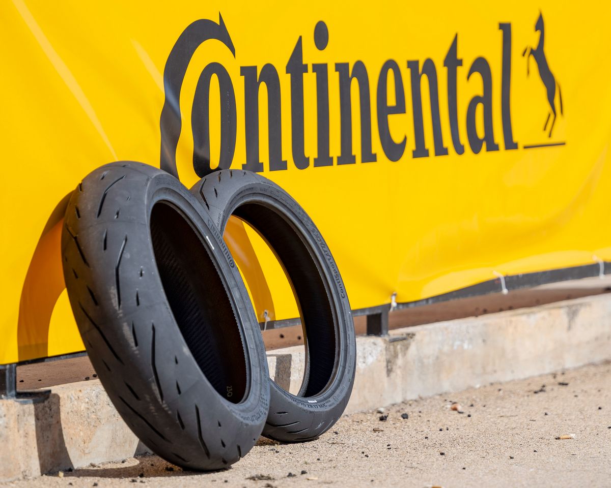 two Continental ContiSportAttack 5 tires and a yellow banner with the word "Continental" in black