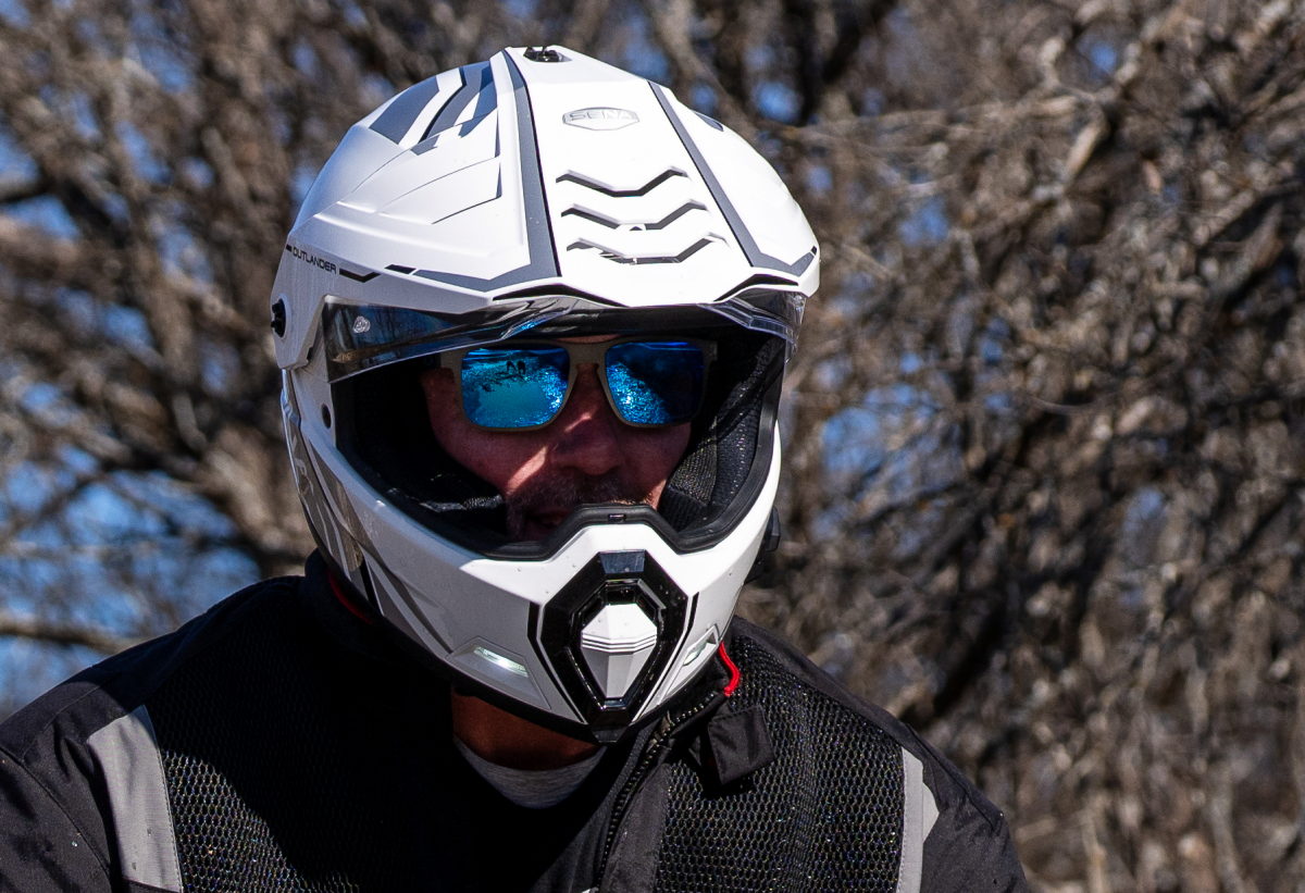 A white Sena Outlander helmet