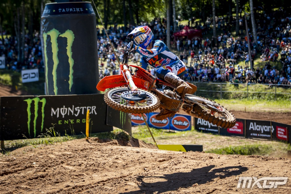Sasha Coenen lays his motorcycle flat during a jump