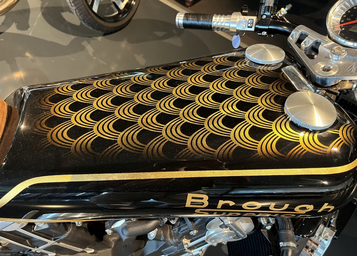 The fuel tank with gold accents on a Brough Superior Anniversary Golden Dream